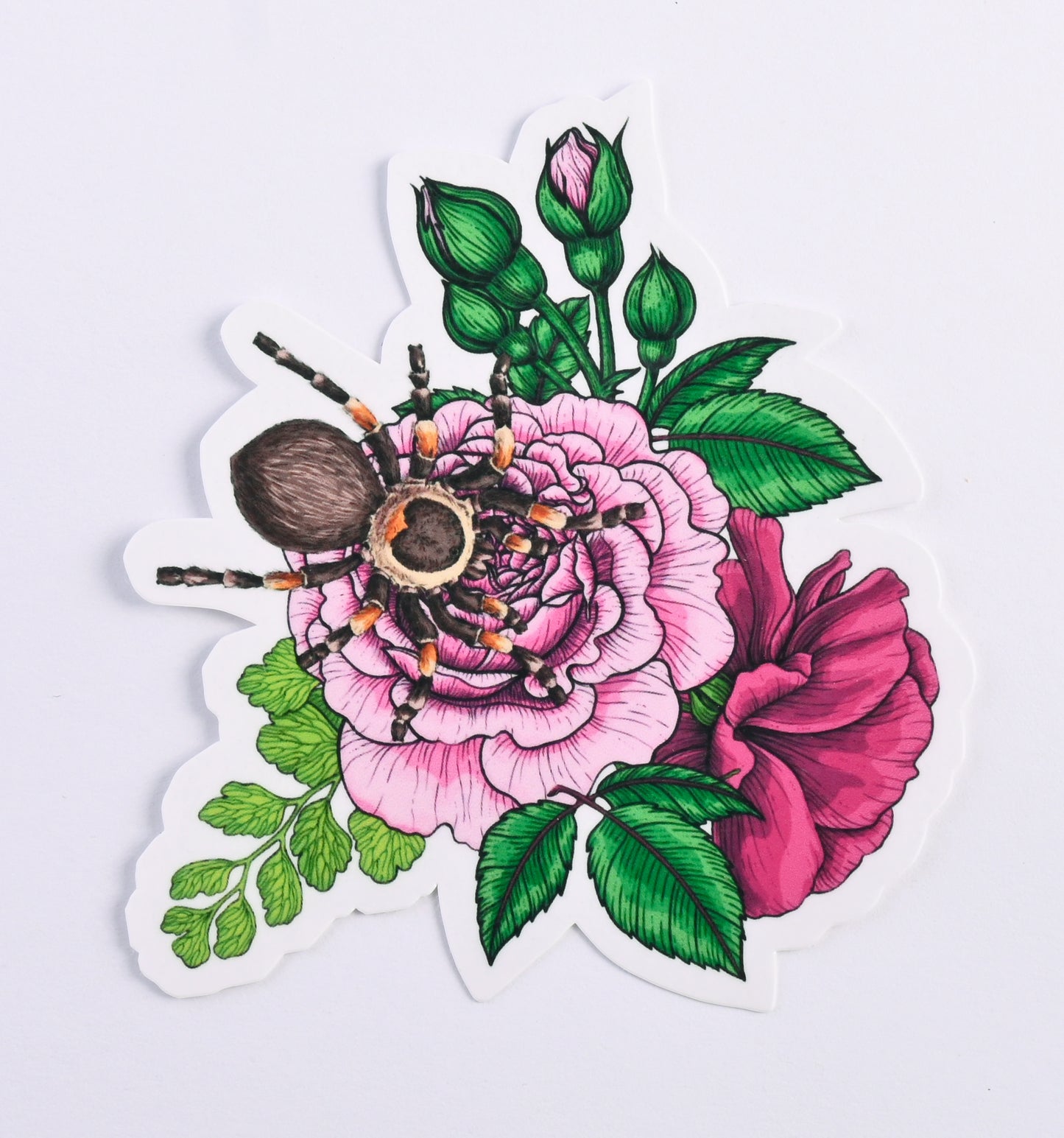 photo of a sticker featuring illustrated bouquet of flowers and tarantula