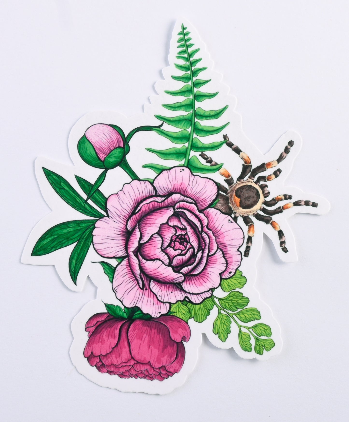 photo of a sticker featuring illustrated bouquet of flowers and tarantula