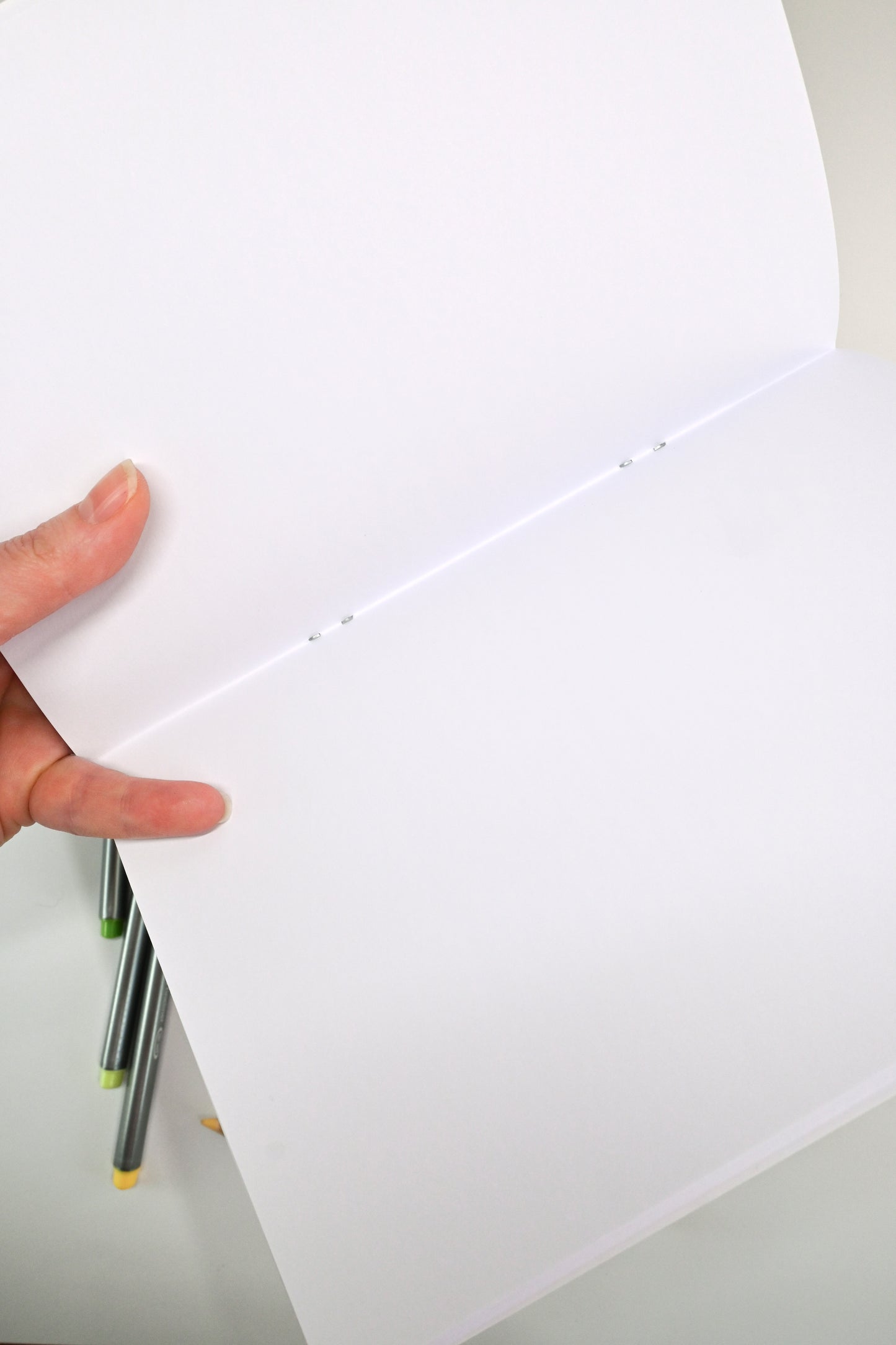 photo of hand-made notebook with hand-painted lemon pattern print on the cover