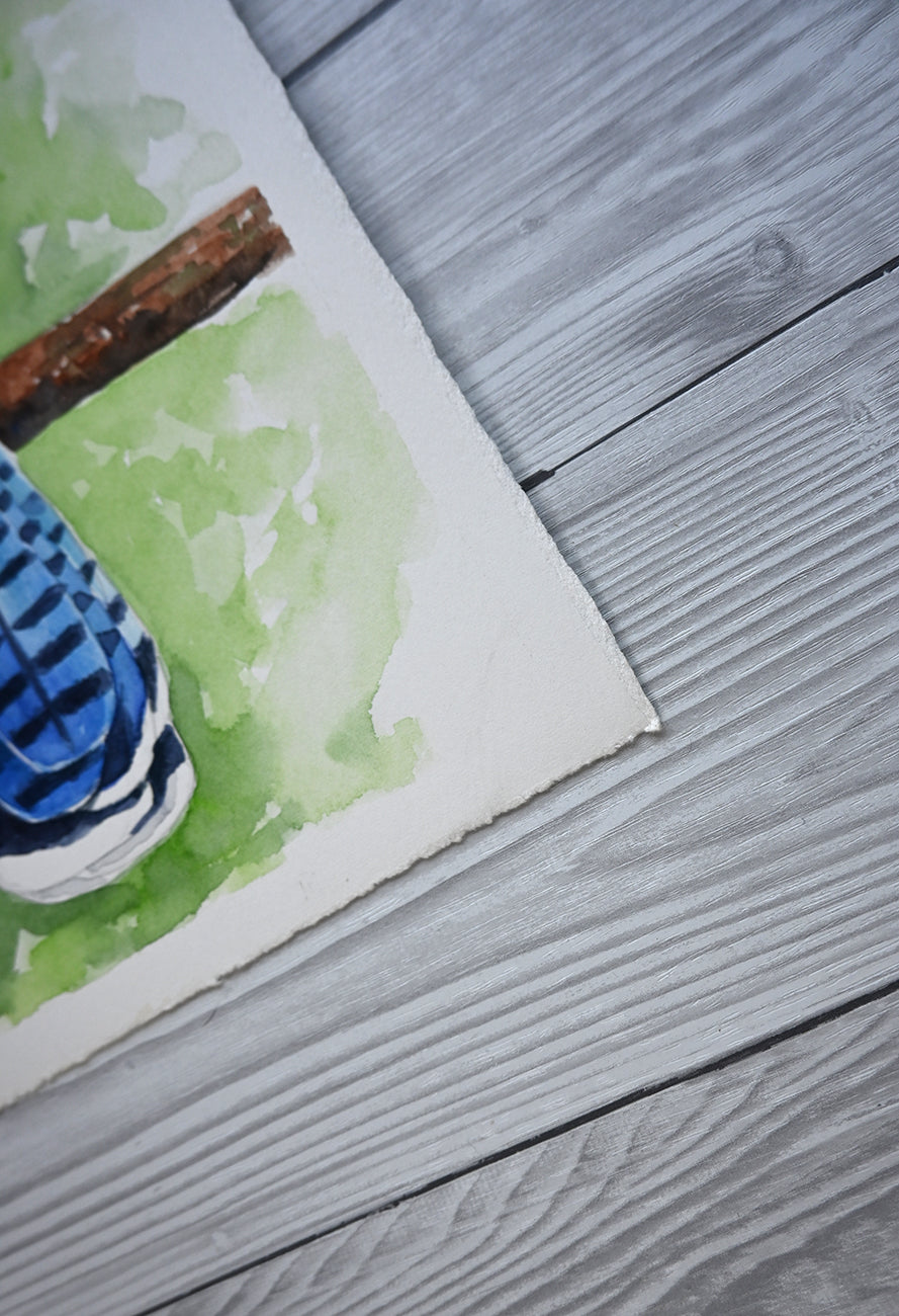 close up on the corner of a watercolor painting featuring blue jay