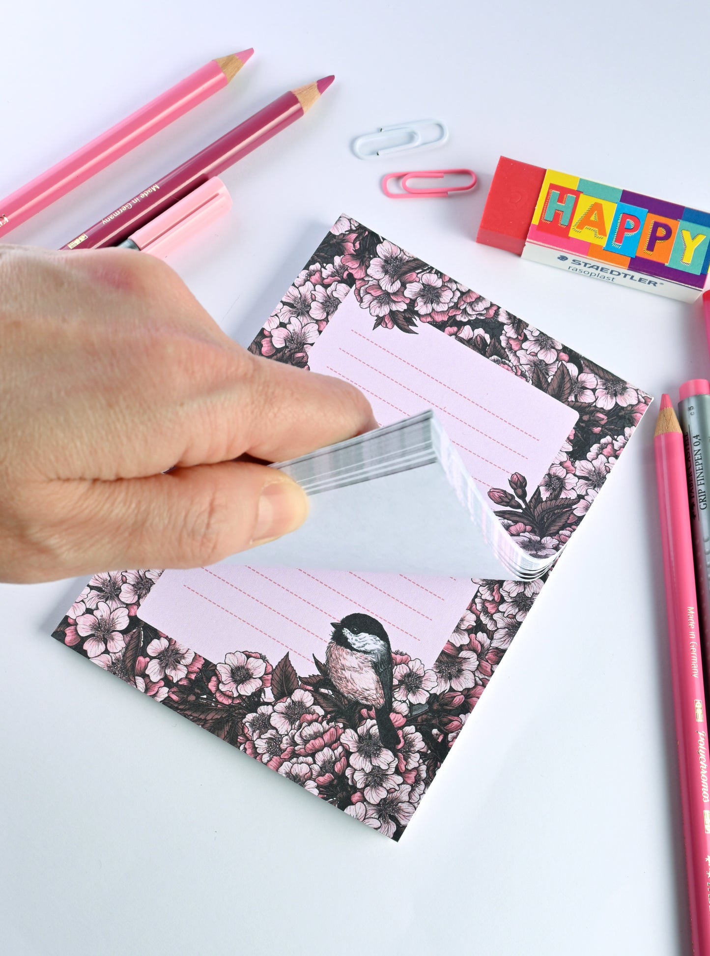 notepad featuring hand painted frame of cherry blosssom and chicakee bird in the lower right corner and lined middle