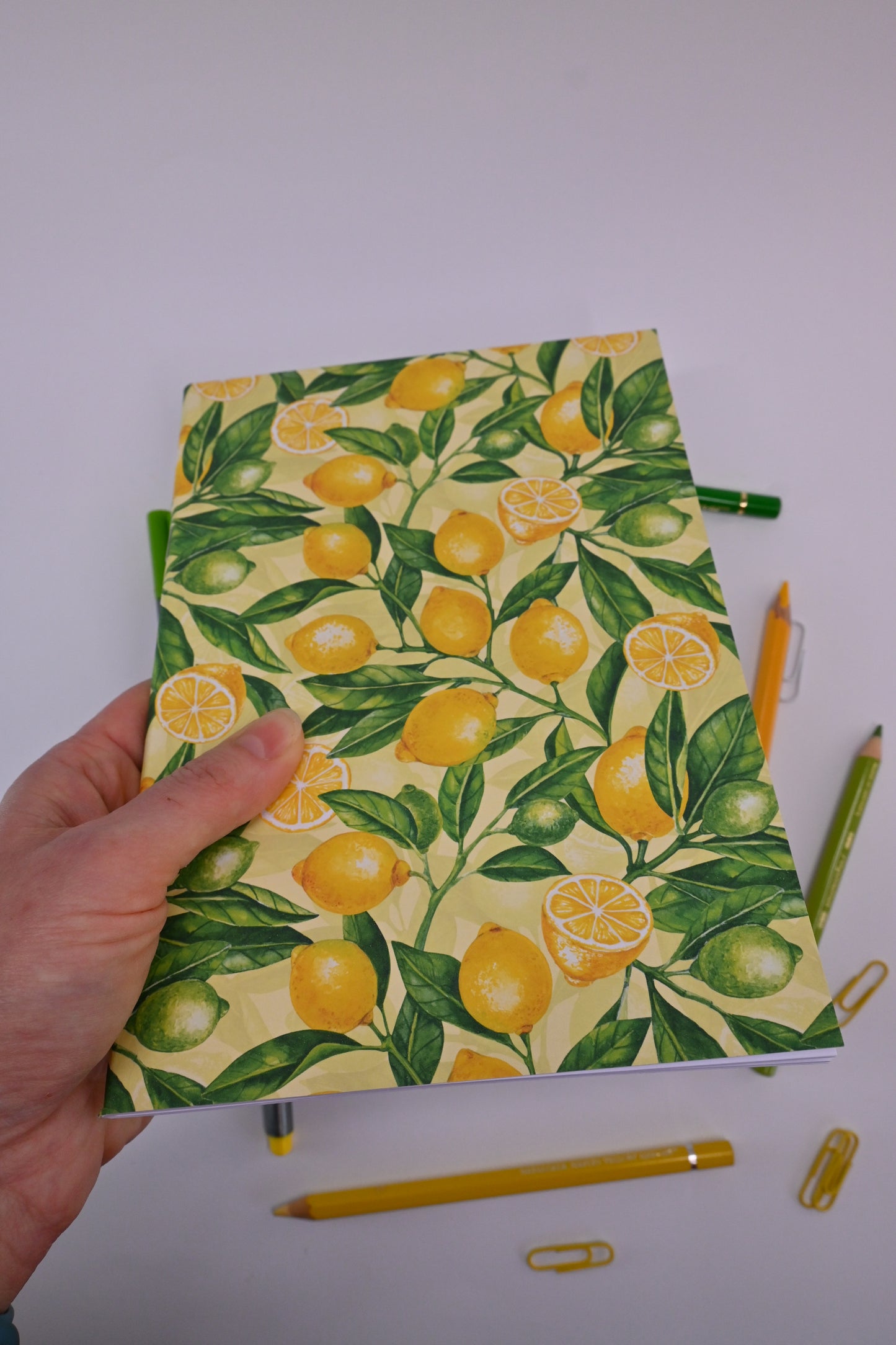 photo of hand-made notebook with hand-painted lemon pattern print on the cover