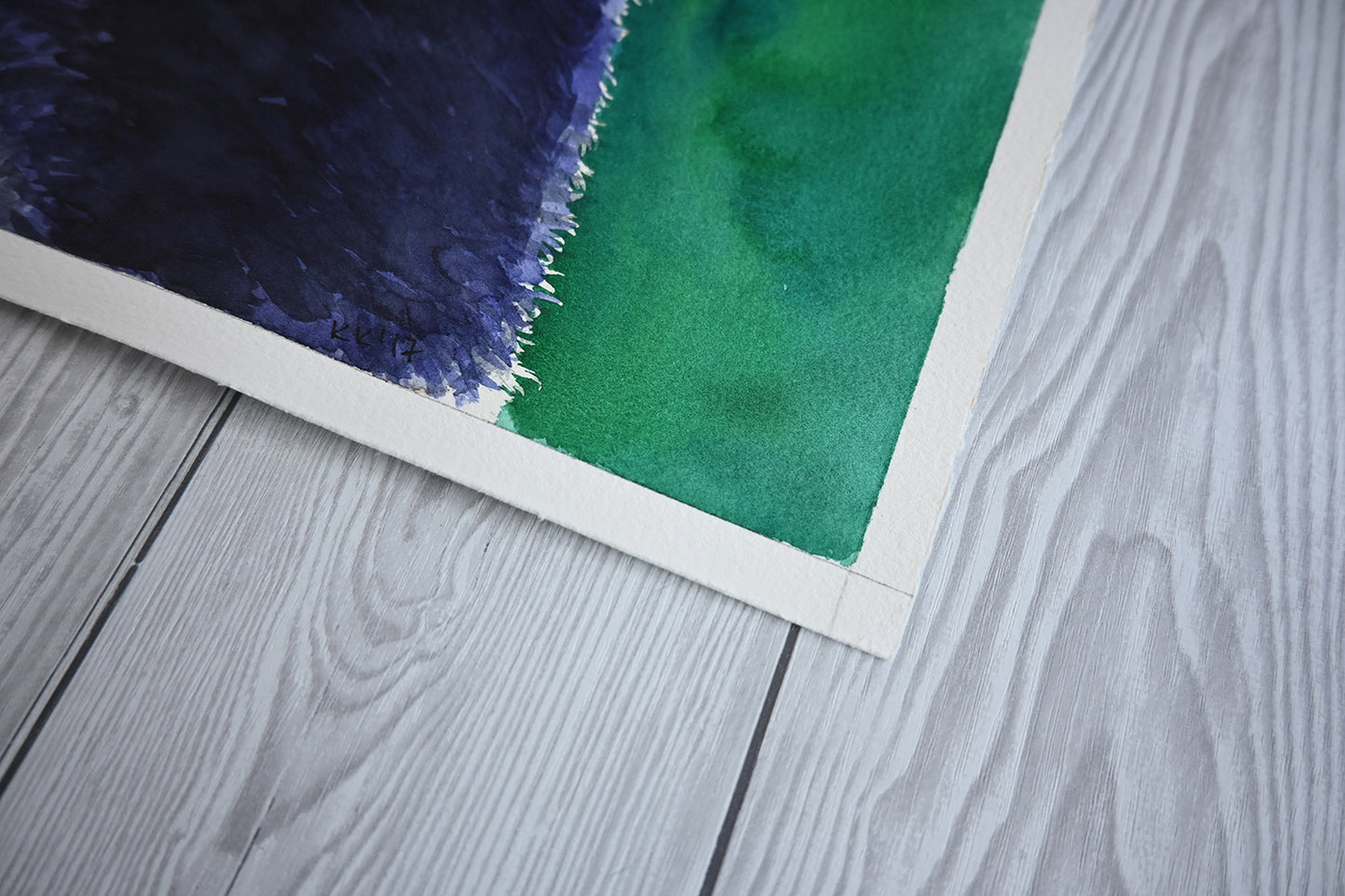close up of the corner of a watercolor painting