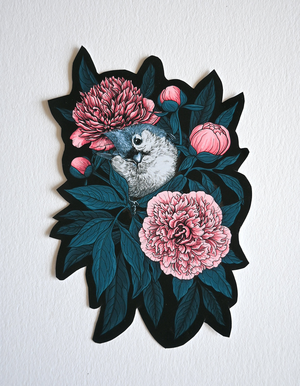 Vinyl sticker with a bird and pink flowers on a white background