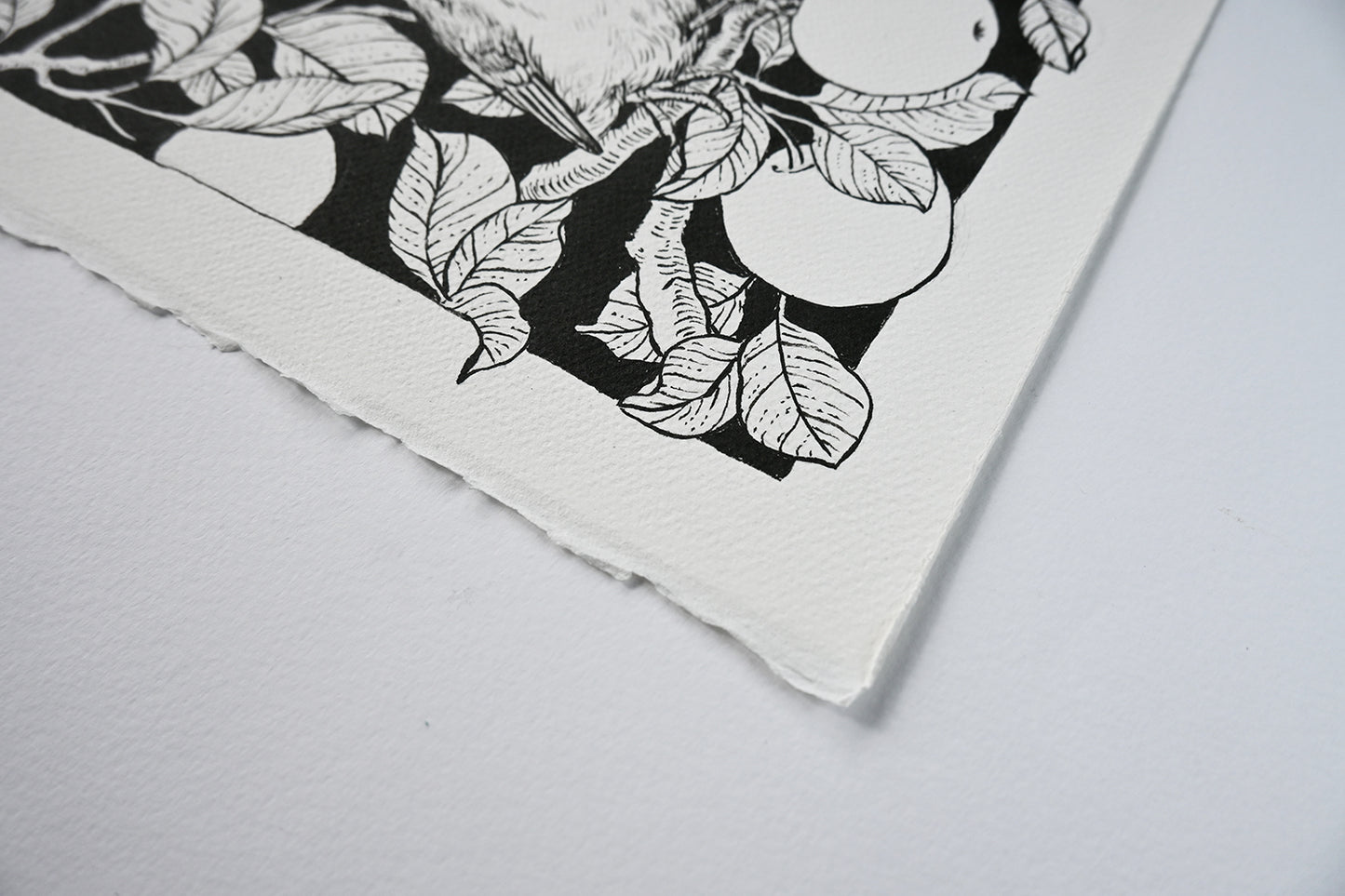 Black and white floral design on a textured fabric surface