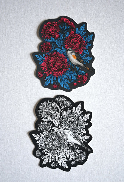 Two vinyl stickers  with chrysanthemum flowers and bird designs on a white background. 