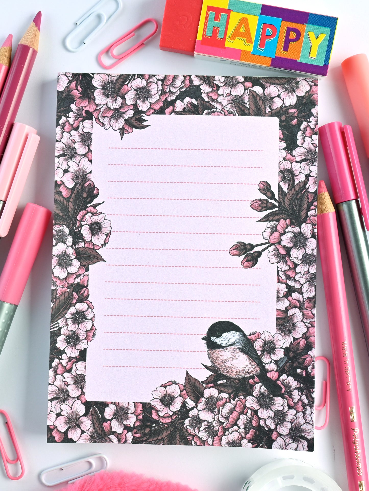 notepad featuring hand painted frame of cherry blosssom and chicakee bird in the lower right corner and  lined middle