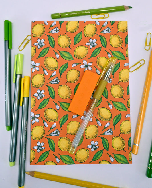 photo of hand-made notebook with hand-painted lemon pattern print on the cover