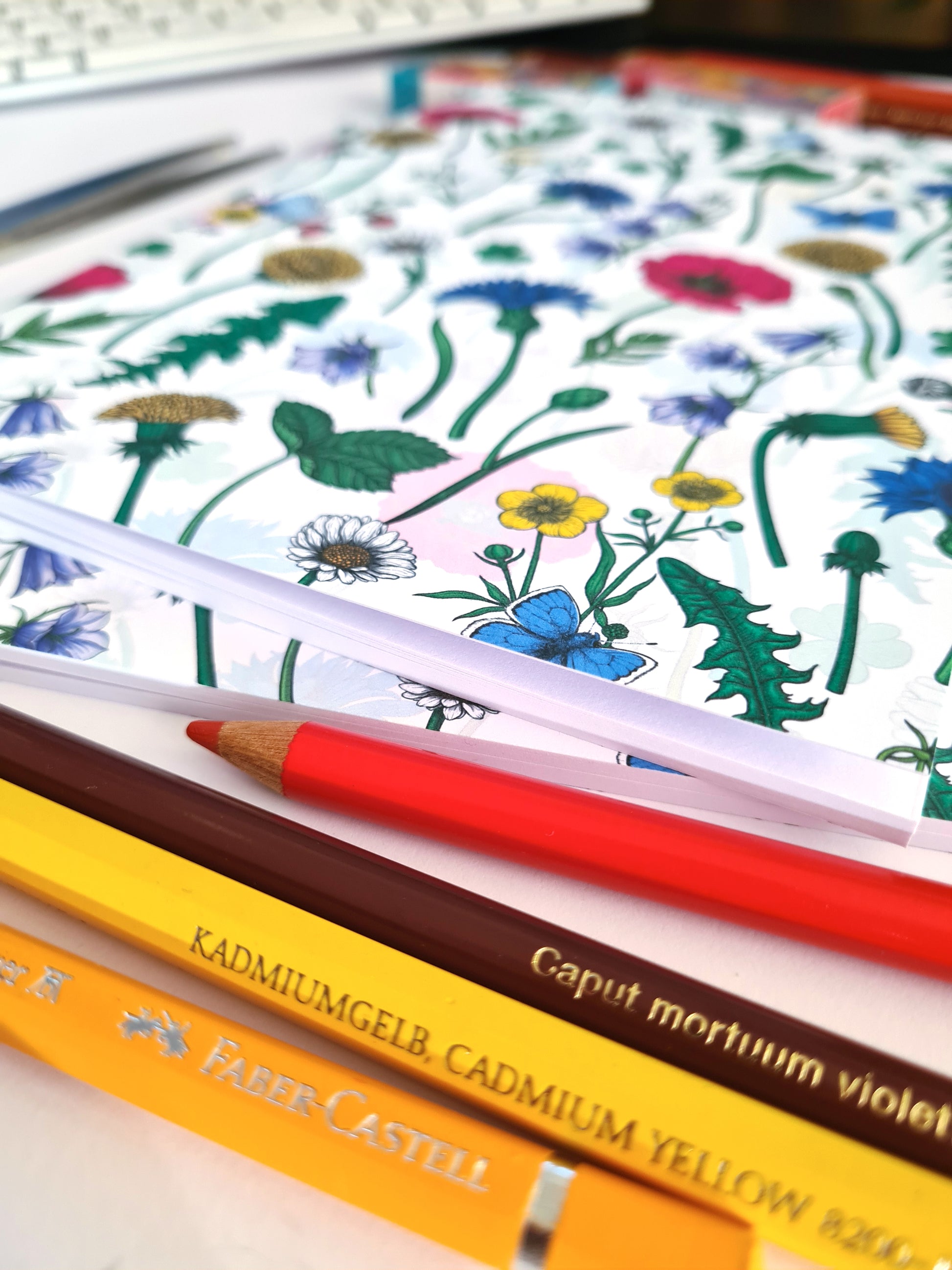 photo of hand-made notebook with hand-painted Wildflowers pattern print on the cover