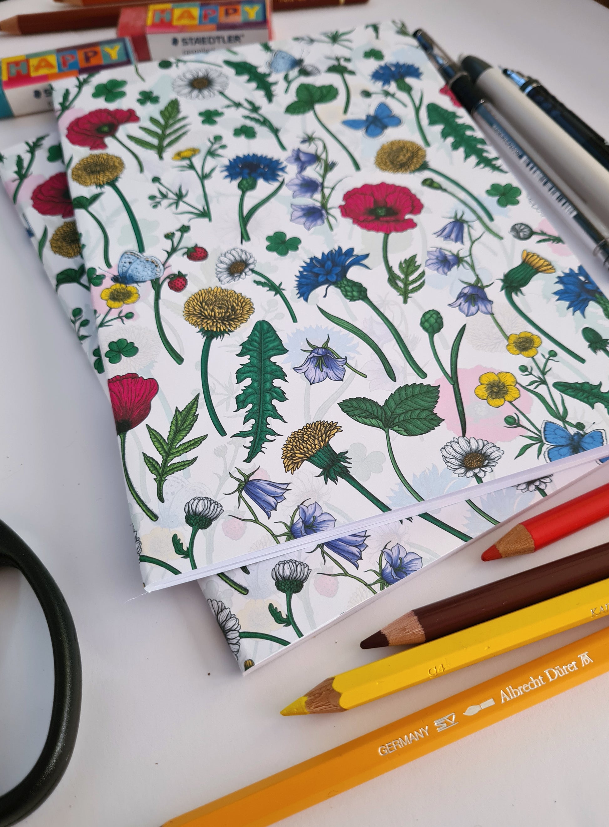 photo of hand-made notebook with hand-painted Wildflowers pattern print on the cover