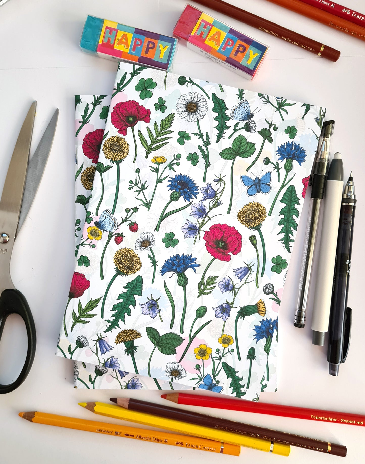 photo of hand-made notebook with hand-painted Wildflowers pattern print on the cover