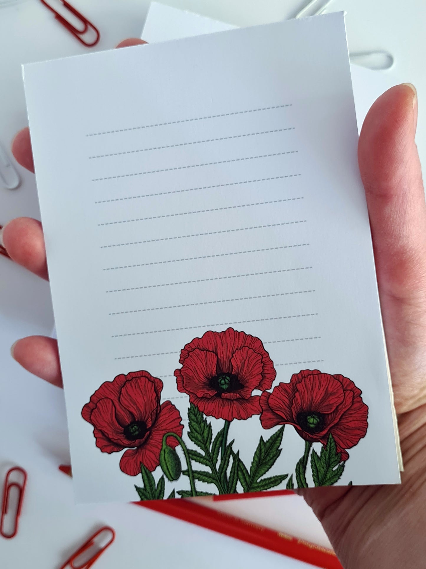 notepad ilustrated with red poppy flowers