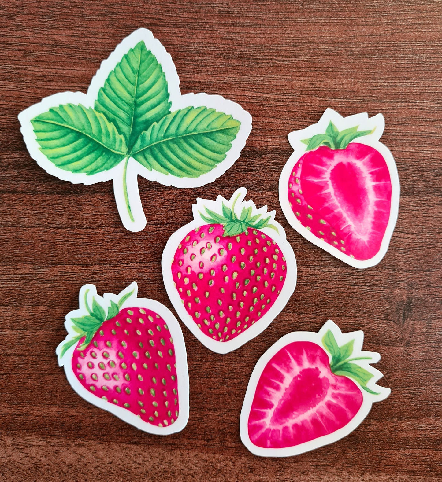 photo of 4 stickers with strawberries and 1 with leaf