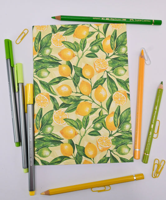 photo of hand-made notebook with hand-painted lemon pattern print on the cover