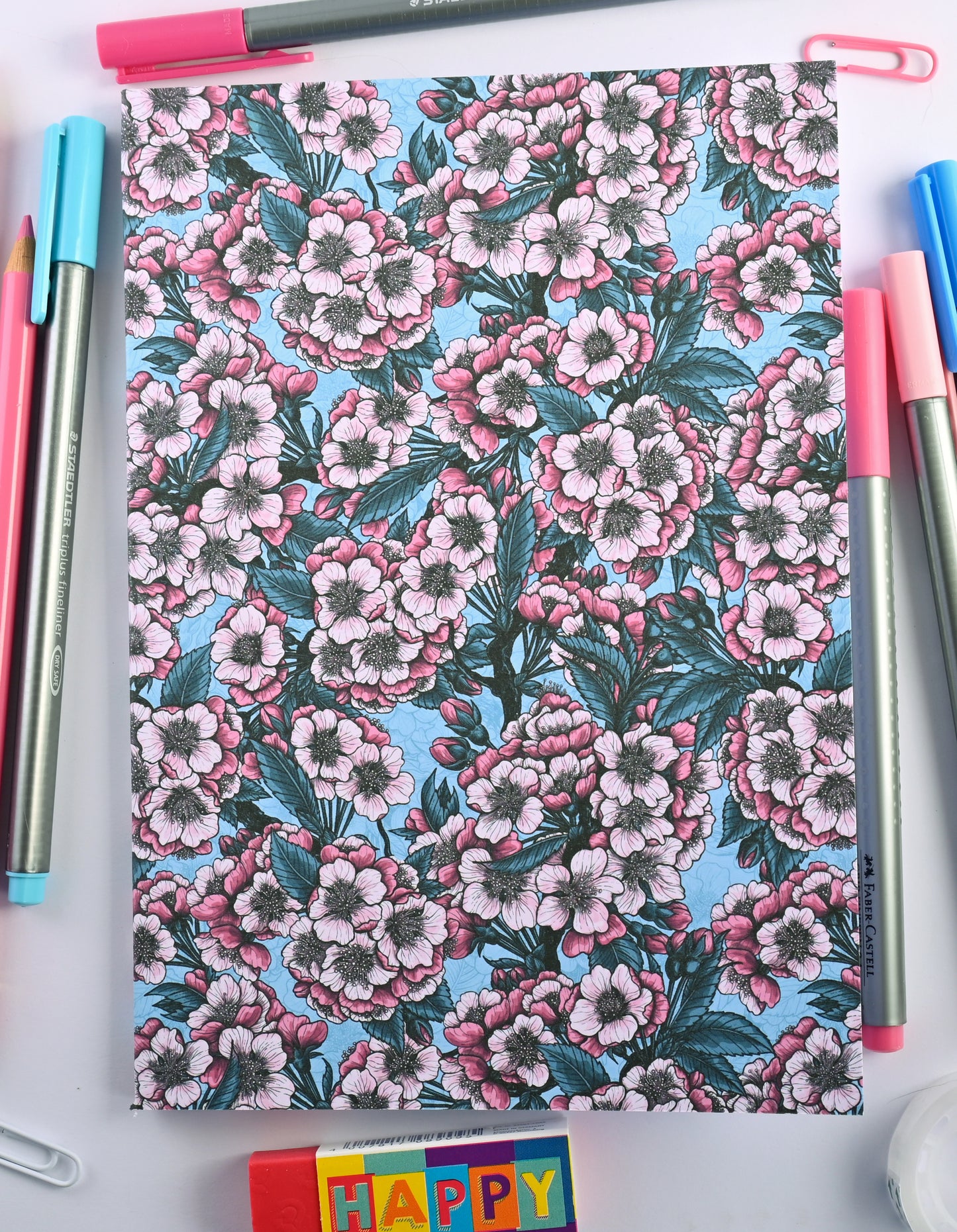 photo of hand-made notebook with cherry blossom pattern print on the cover