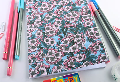 photo of hand-made notebook with cherry blossom pattern print on the cover