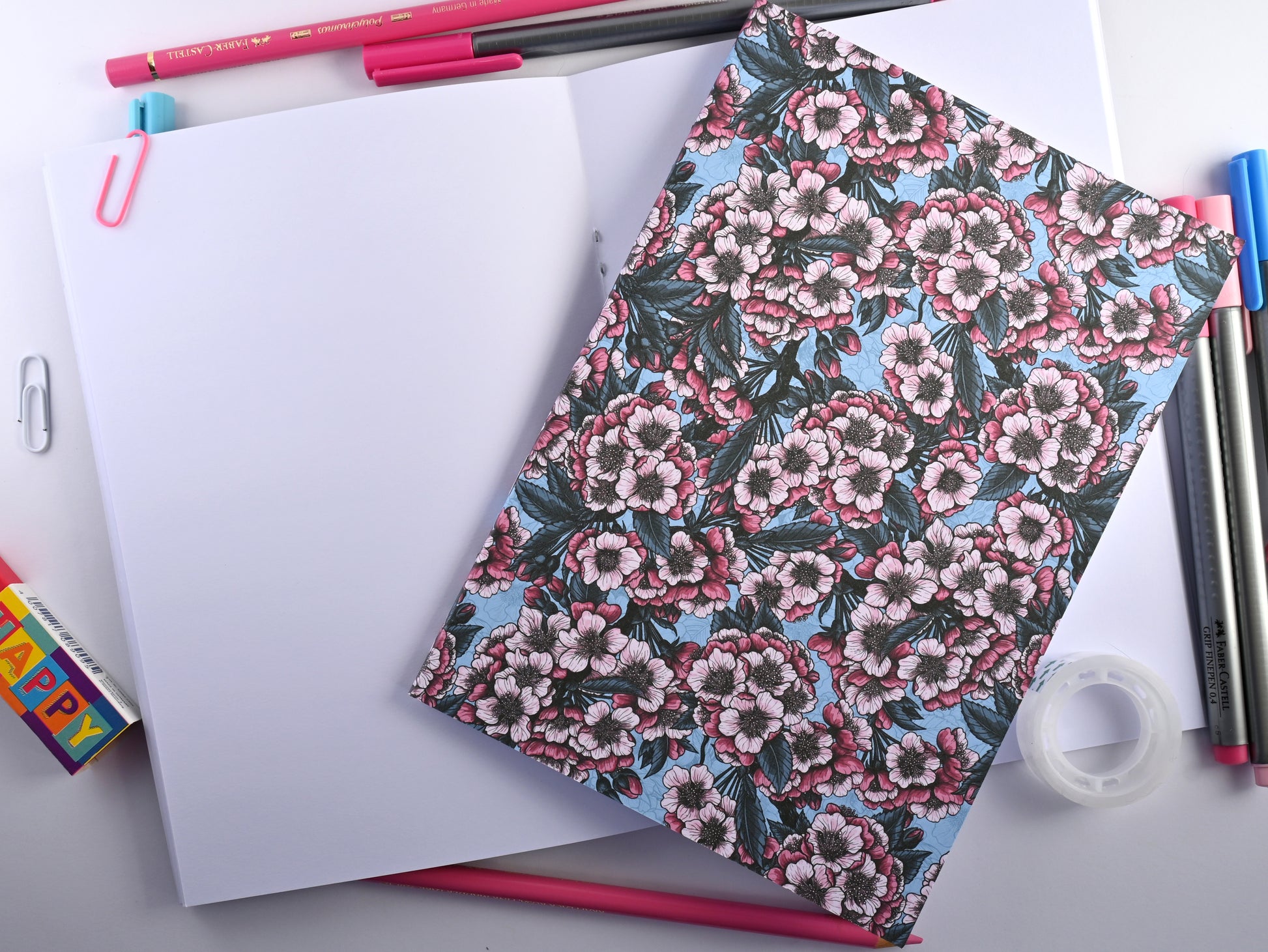 photo of hand-made notebook with cherry blossom pattern print on the cover