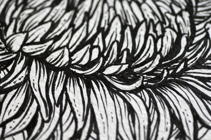 close up of a chrysanthemum flower painted with black ink