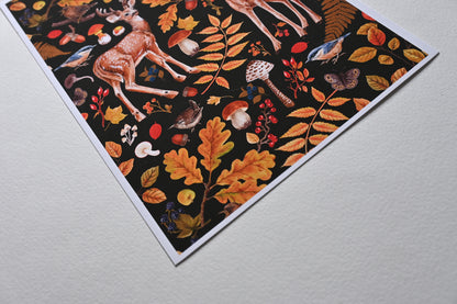 close up of the corner of print of two deer among autumnal flora, mushrooms and birds