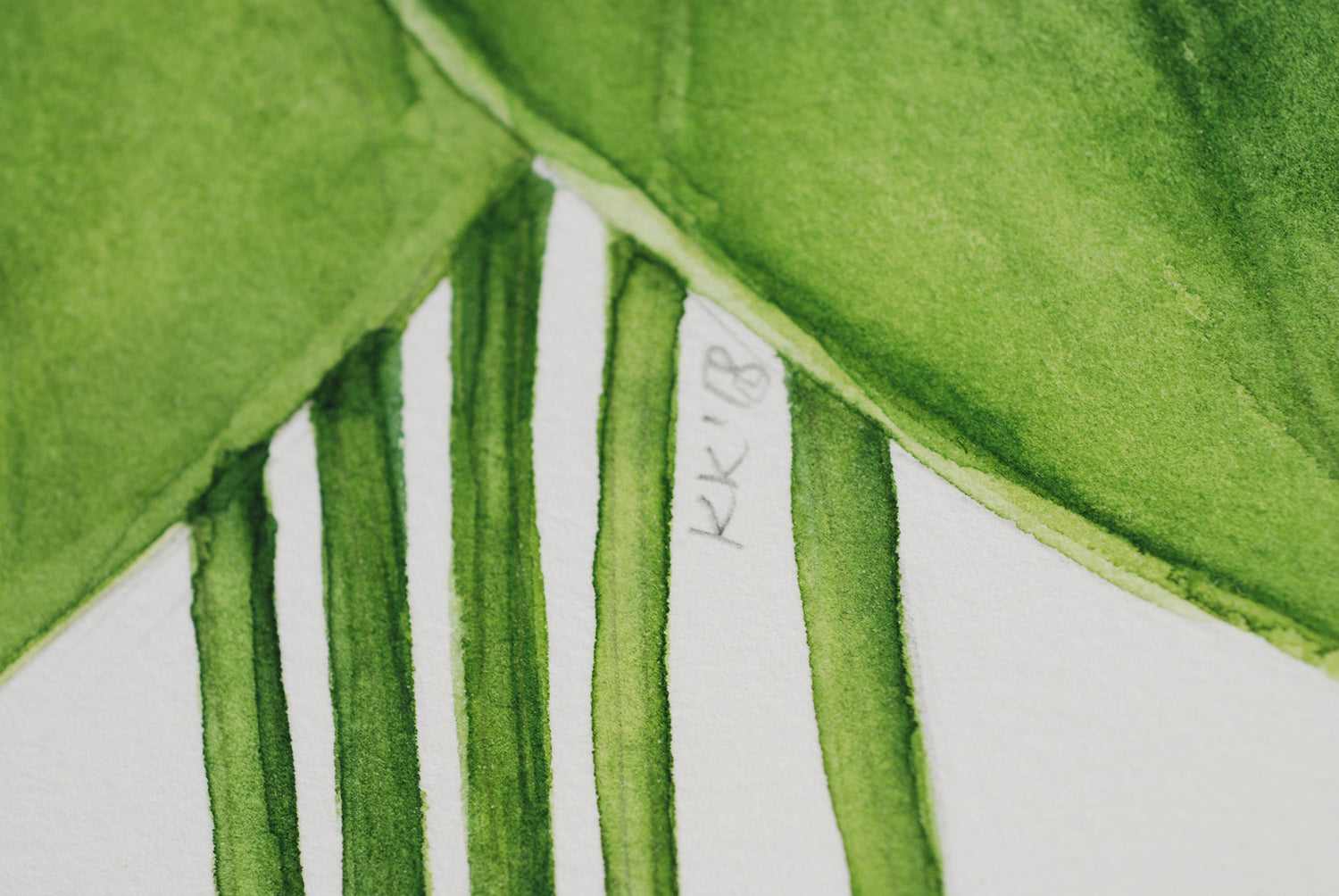 close up of a watercolor painting with initials