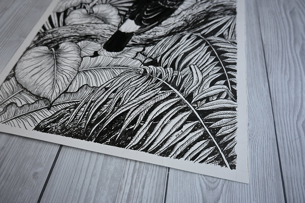 close up corner photo of a original painting of a toucan perching on dry wood in the jungle painted with black ink