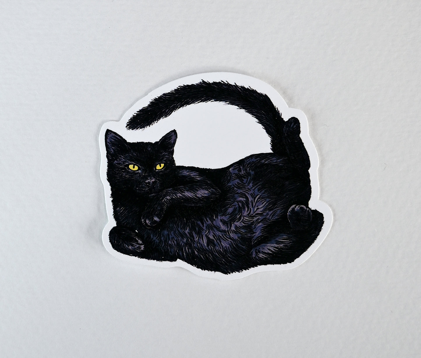 Sticker of a black cat on a white background