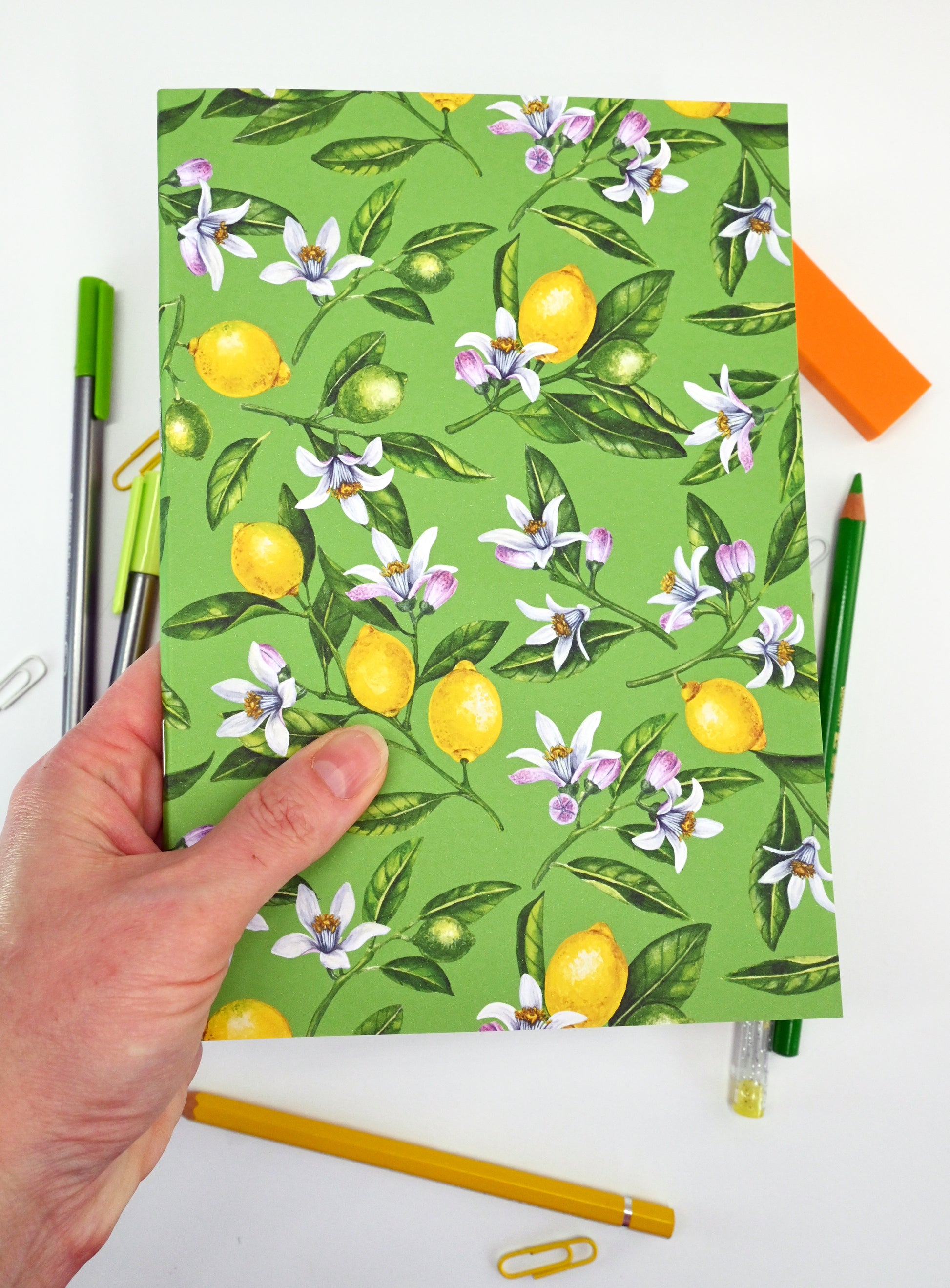 photo of hand-made notebook with hand-painted lemon pattern print on the cover