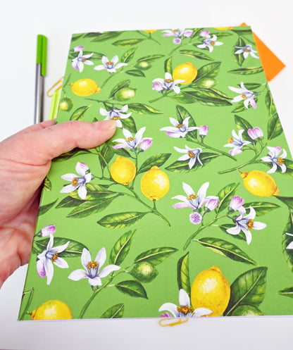 photo of hand-made notebook with hand-painted lemon pattern print on the cover