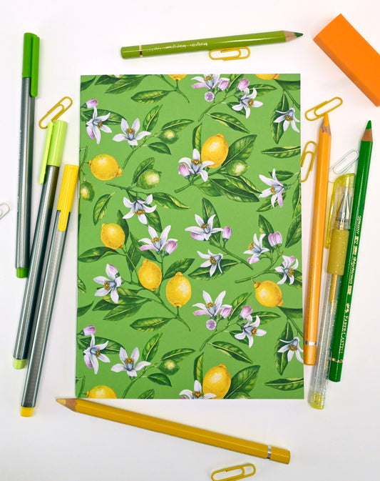 photo of hand-made notebook with hand-painted lemon pattern print on the cover