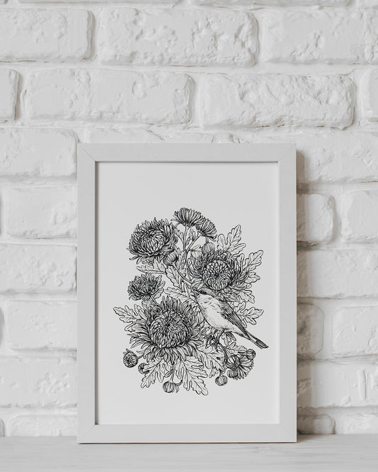 Framed botanical illustration of a bird and flowers on a white brick wall.