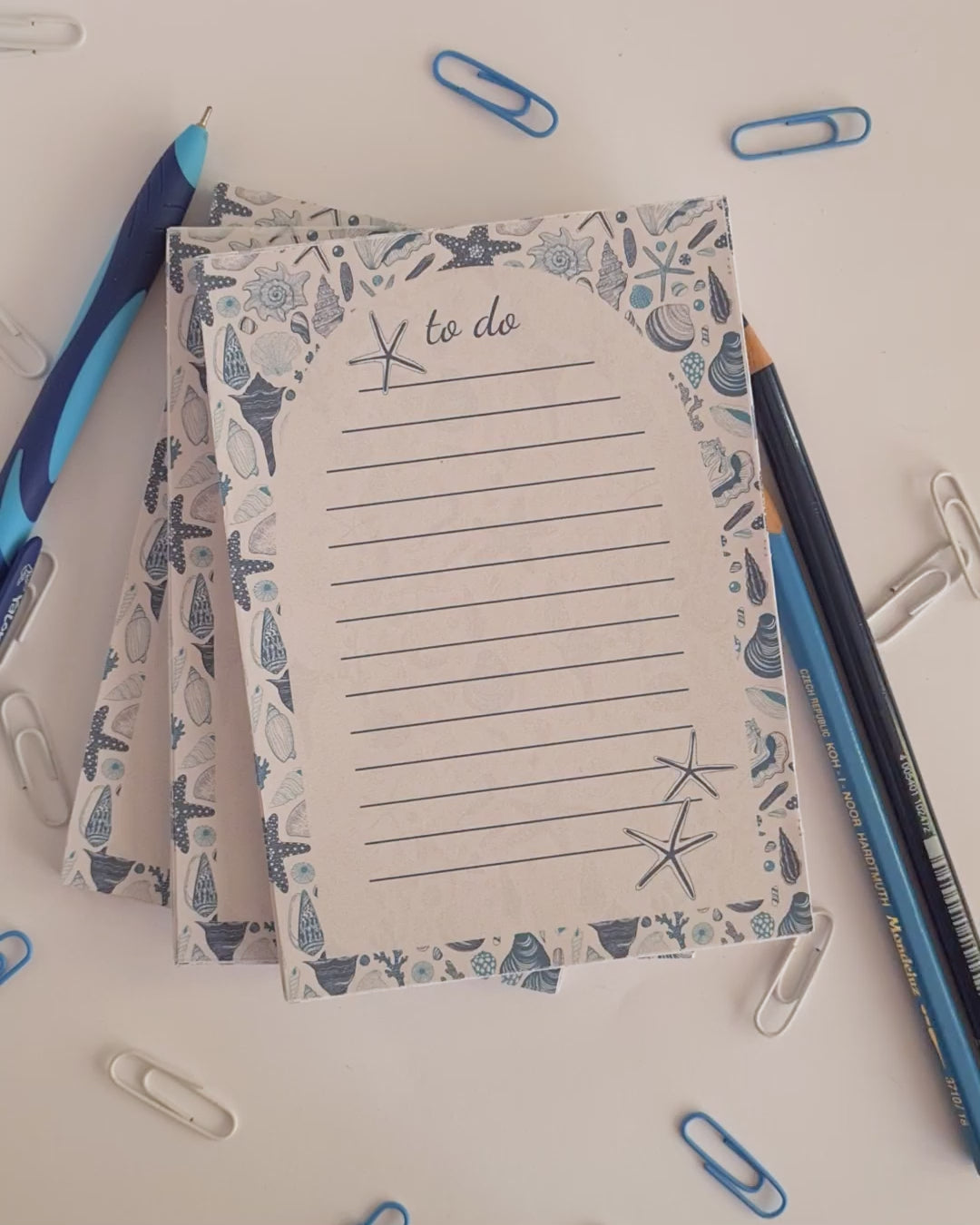 viodeo of notepads ilustrated with hand-painted Seashells pattern