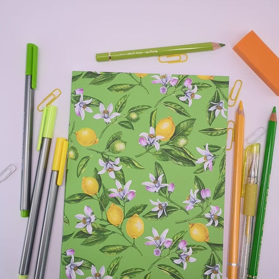 video showing a hand-made notebook with hand-painted lemon pattern print on the cover