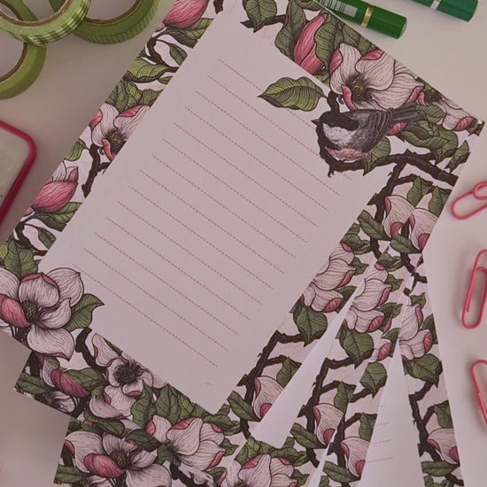 video of a hand-made notepad illustrated with Magnolia and Chickadee birds 