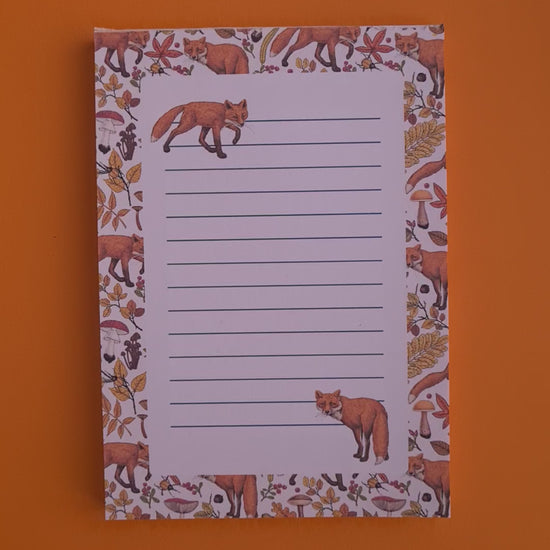 video of notepads ilustrated with hand-painted red Foxes and autumn flora