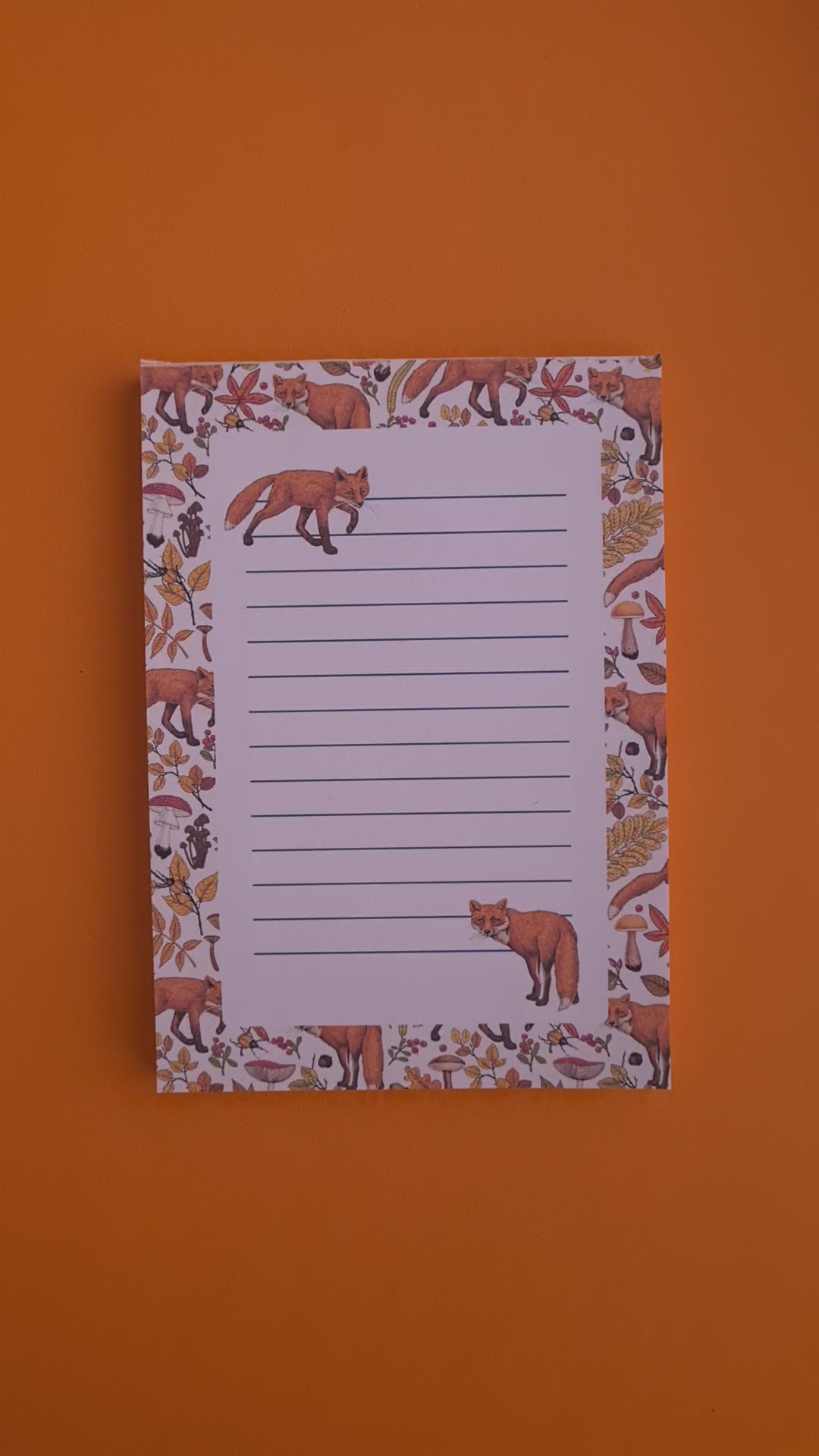 video of notepads ilustrated with hand-painted red Foxes and autumn flora